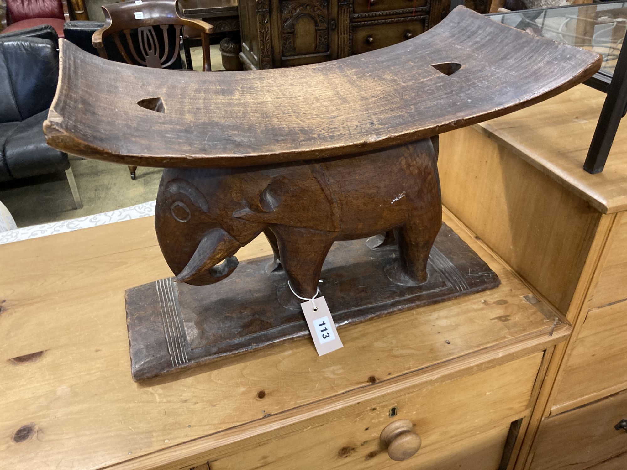 An African carved elephant ashanti stool, width 52cm, depth 26cm, height 35cm